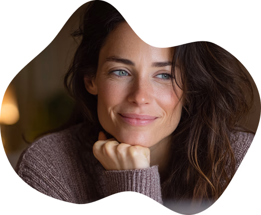 A woman resting her chin on her hand, thinking